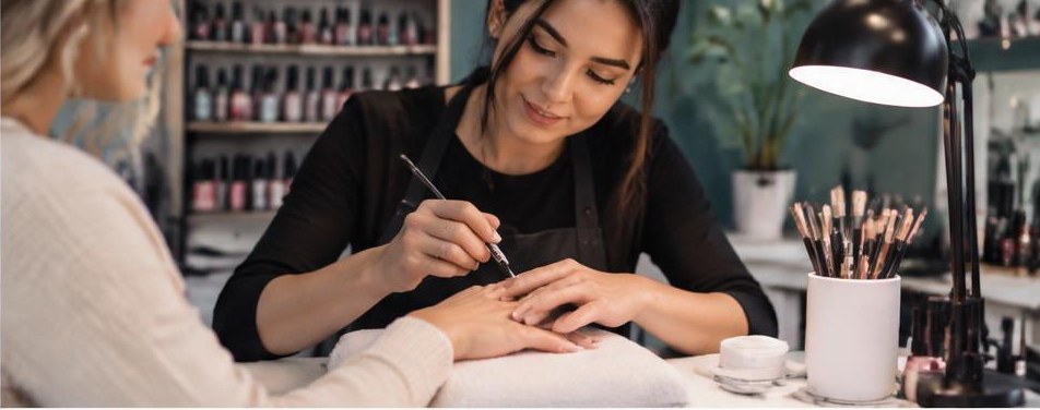 Illustrative nail salon scene showing the people and work behind the business